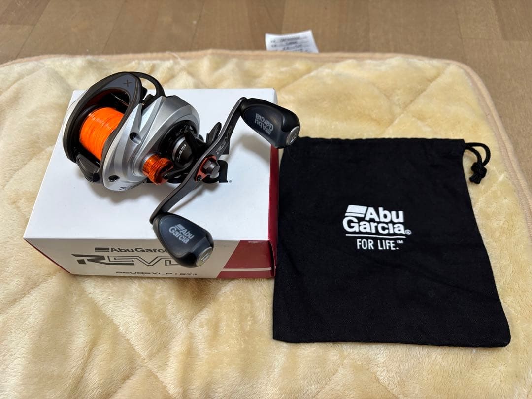 Abu Garcia REVO 5 XLP Baitcasting Reel Silver/Orange, 6.7:1 Gear, Used