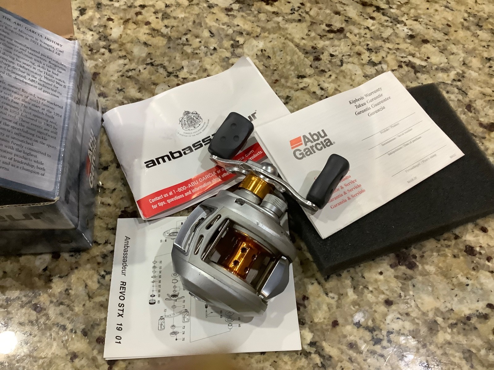 Abu Garcia Ambassadeur Revo STX baitcasting fishing reel box and owners manual.